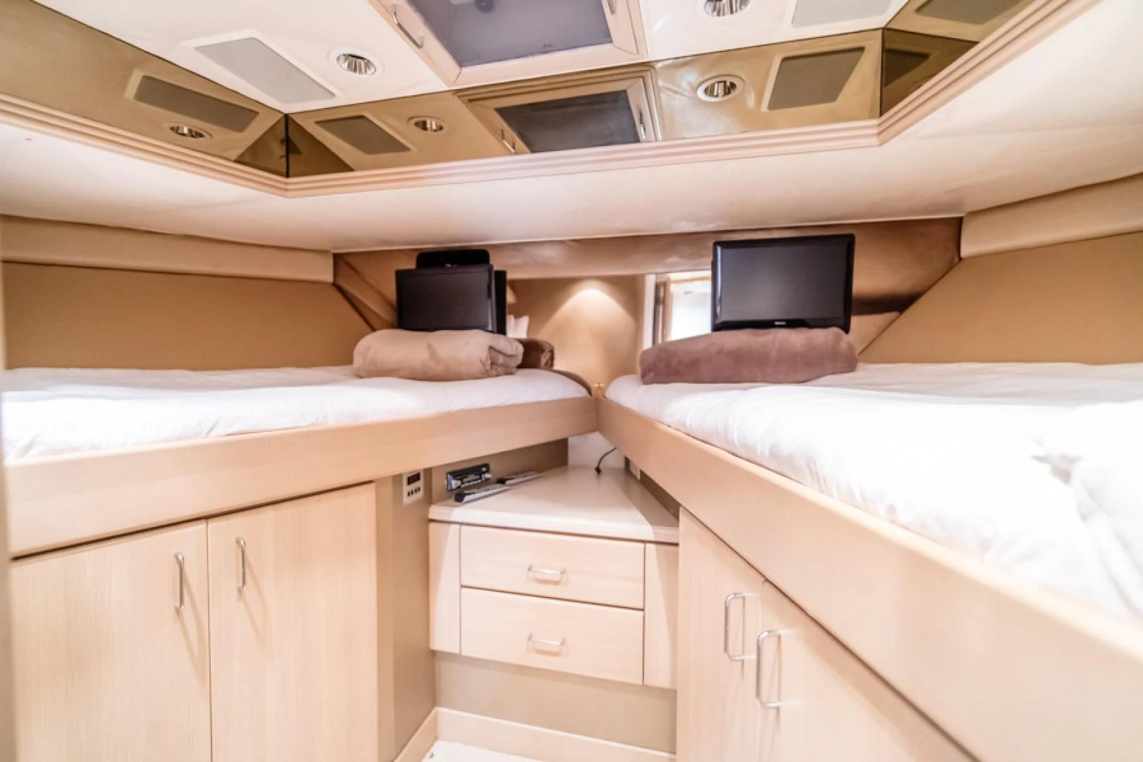 a room with a bed and a television aboard NO EXCEPTIONS Yacht for Sale
