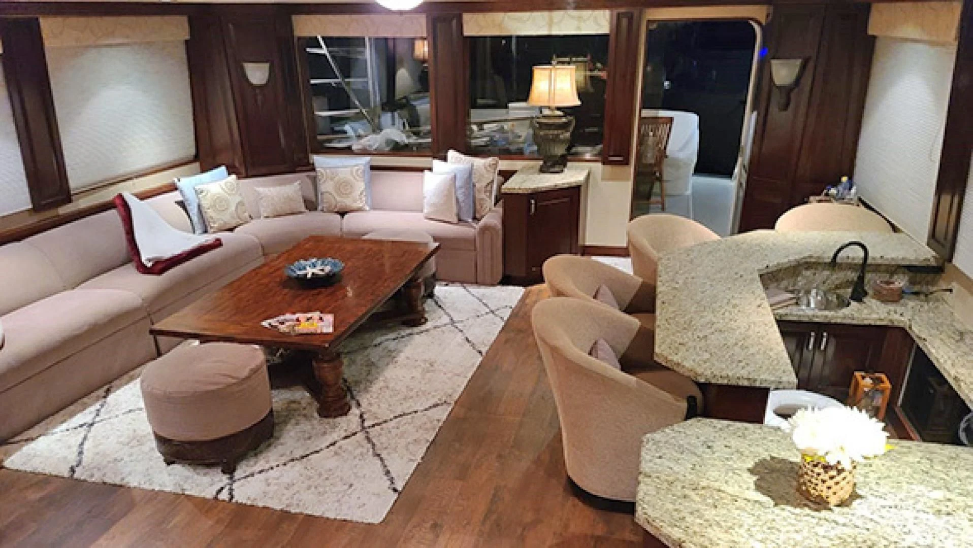 a living room with a couch and a table aboard NO EXCEPTIONS Yacht for Sale