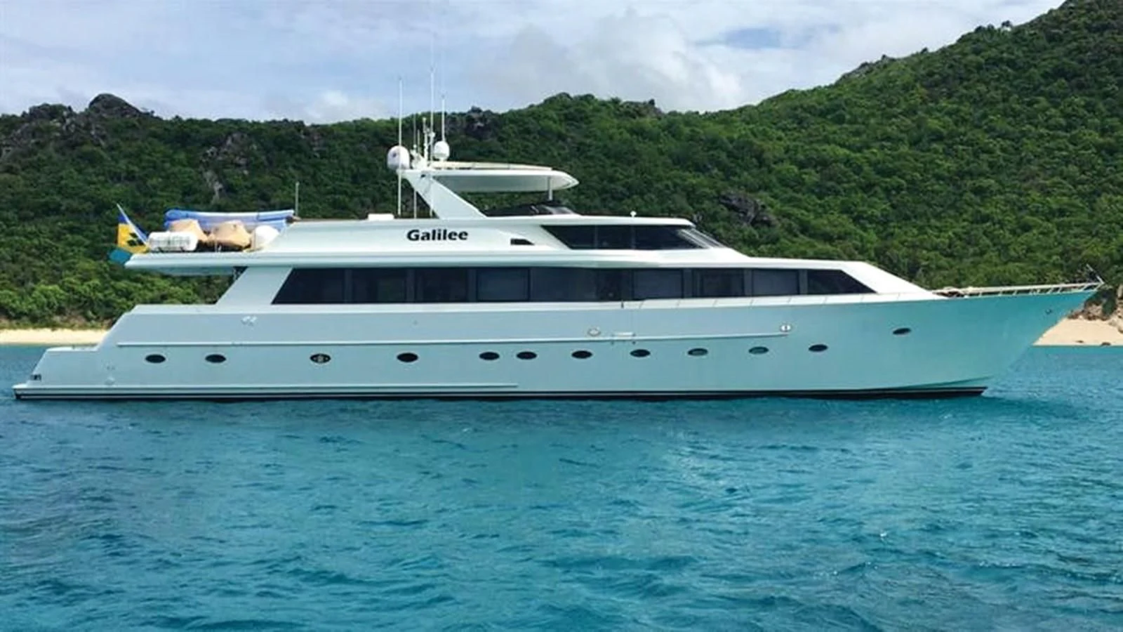 a white yacht on the water aboard NO EXCEPTIONS Yacht for Sale