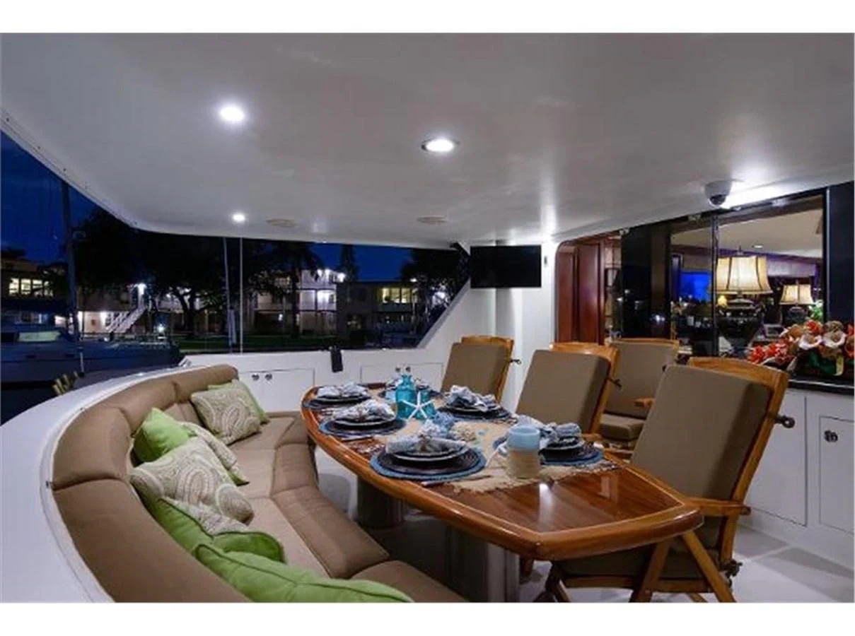 a living room with a couch and a table aboard NO EXCEPTIONS Yacht for Sale
