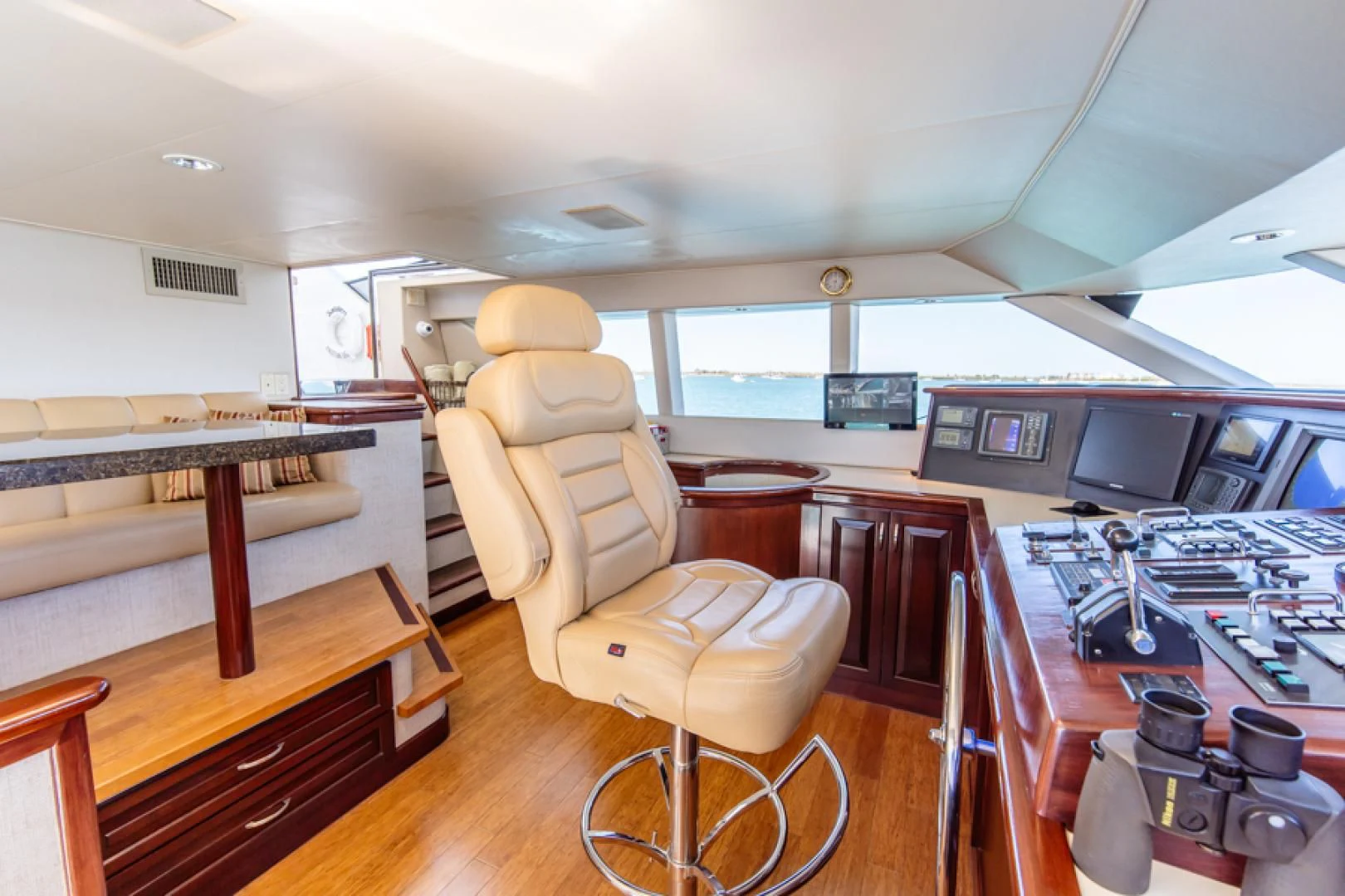 a room with a desk and chairs aboard NO EXCEPTIONS Yacht for Sale