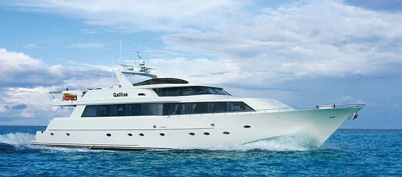 a white yacht in the water aboard NO EXCEPTIONS Yacht for Sale