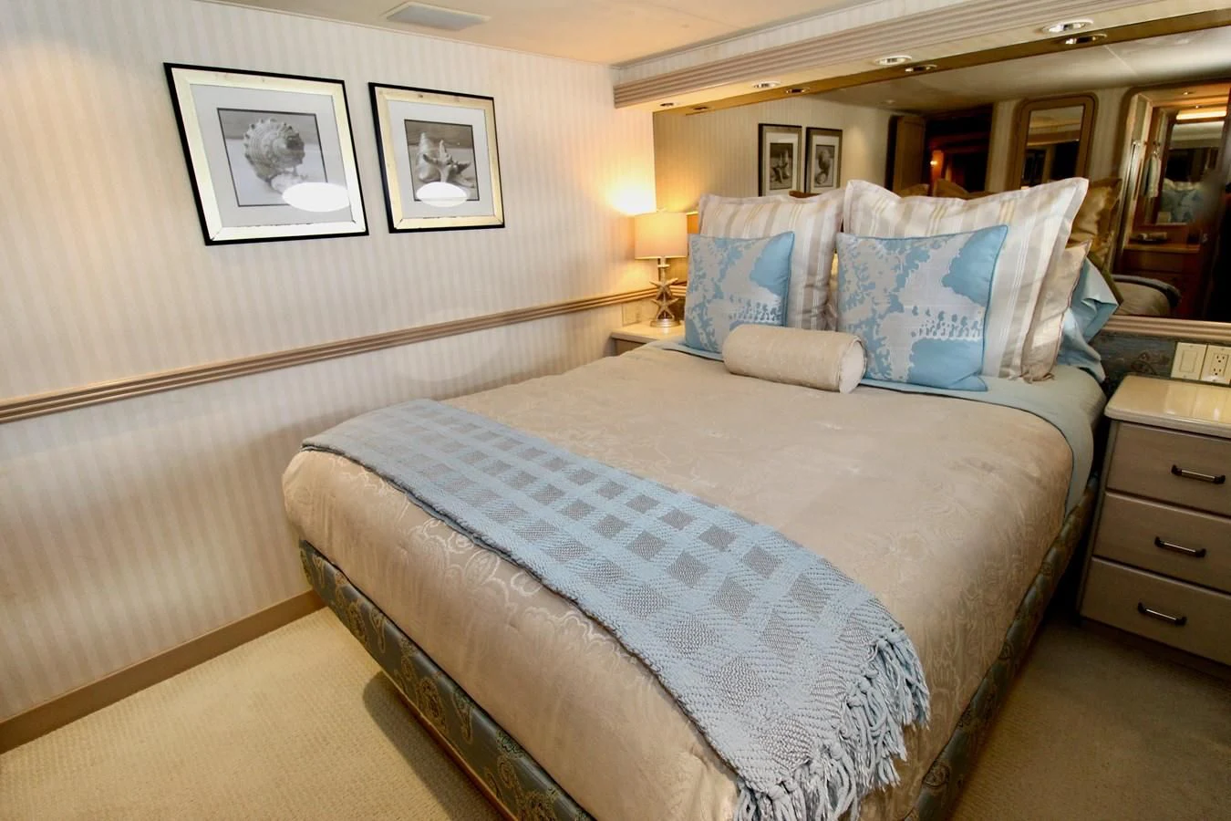 a bed with blue and white sheets aboard NO EXCEPTIONS Yacht for Sale