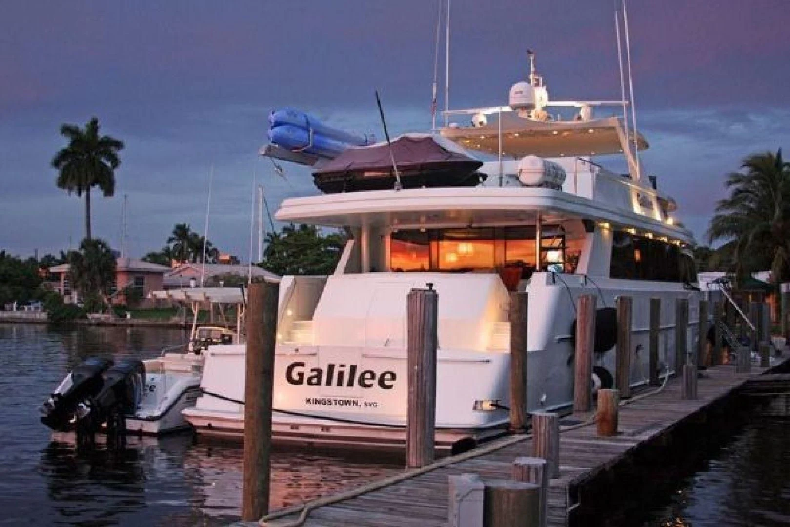 a boat docked at a pier aboard NO EXCEPTIONS Yacht for Sale