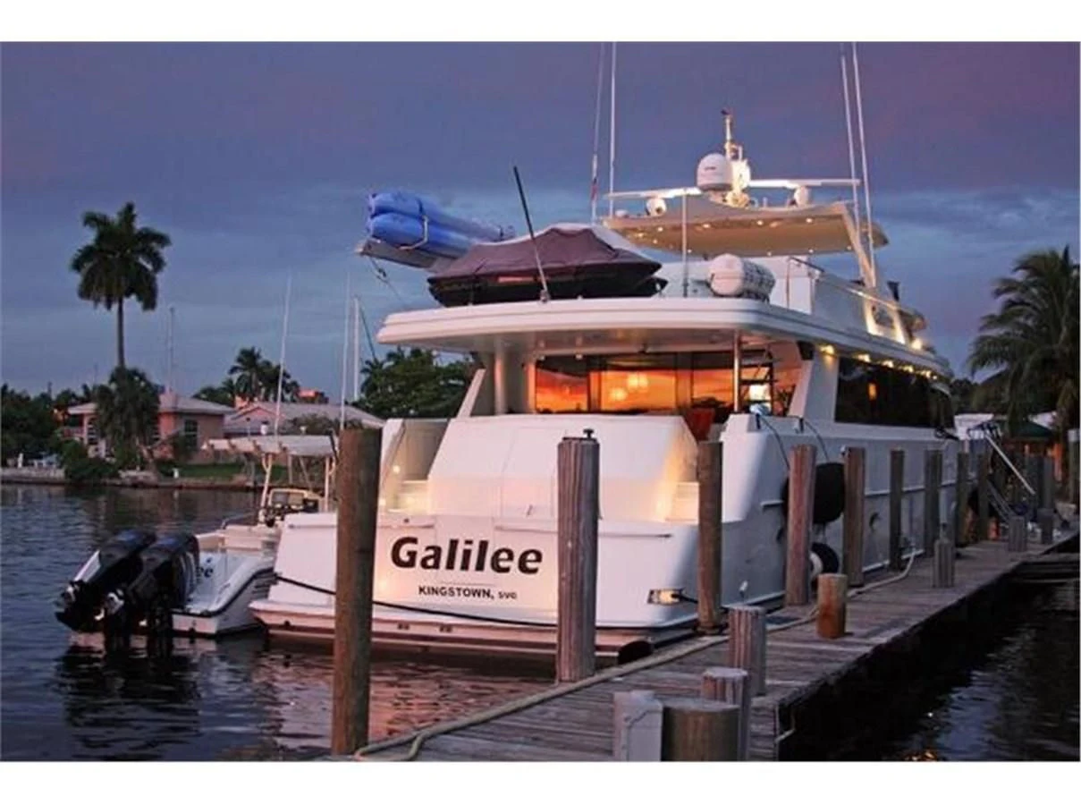 a boat docked at a pier aboard NO EXCEPTIONS Yacht for Sale