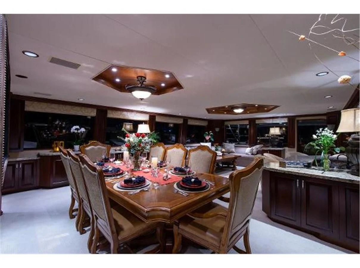 a large kitchen with a dining table aboard NO EXCEPTIONS Yacht for Sale