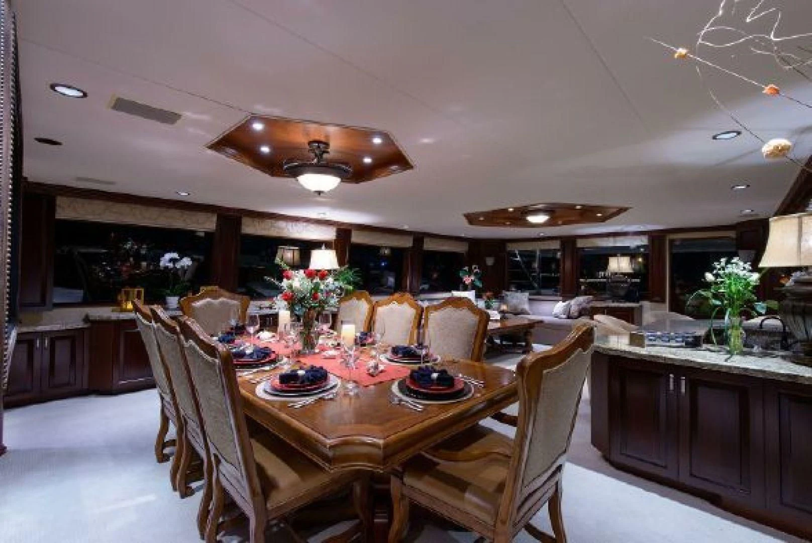 a large kitchen with a dining table aboard NO EXCEPTIONS Yacht for Sale