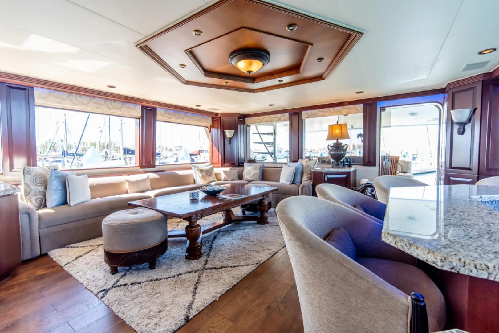 a living room with a large window aboard NO EXCEPTIONS Yacht for Sale