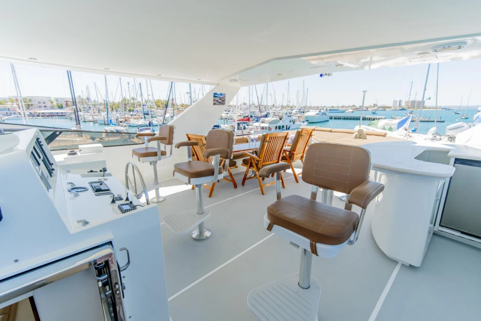 a room with a view of the water and the deck aboard NO EXCEPTIONS Yacht for Sale