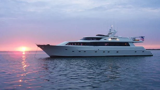 a white yacht in the water aboard NO EXCEPTIONS Yacht for Sale