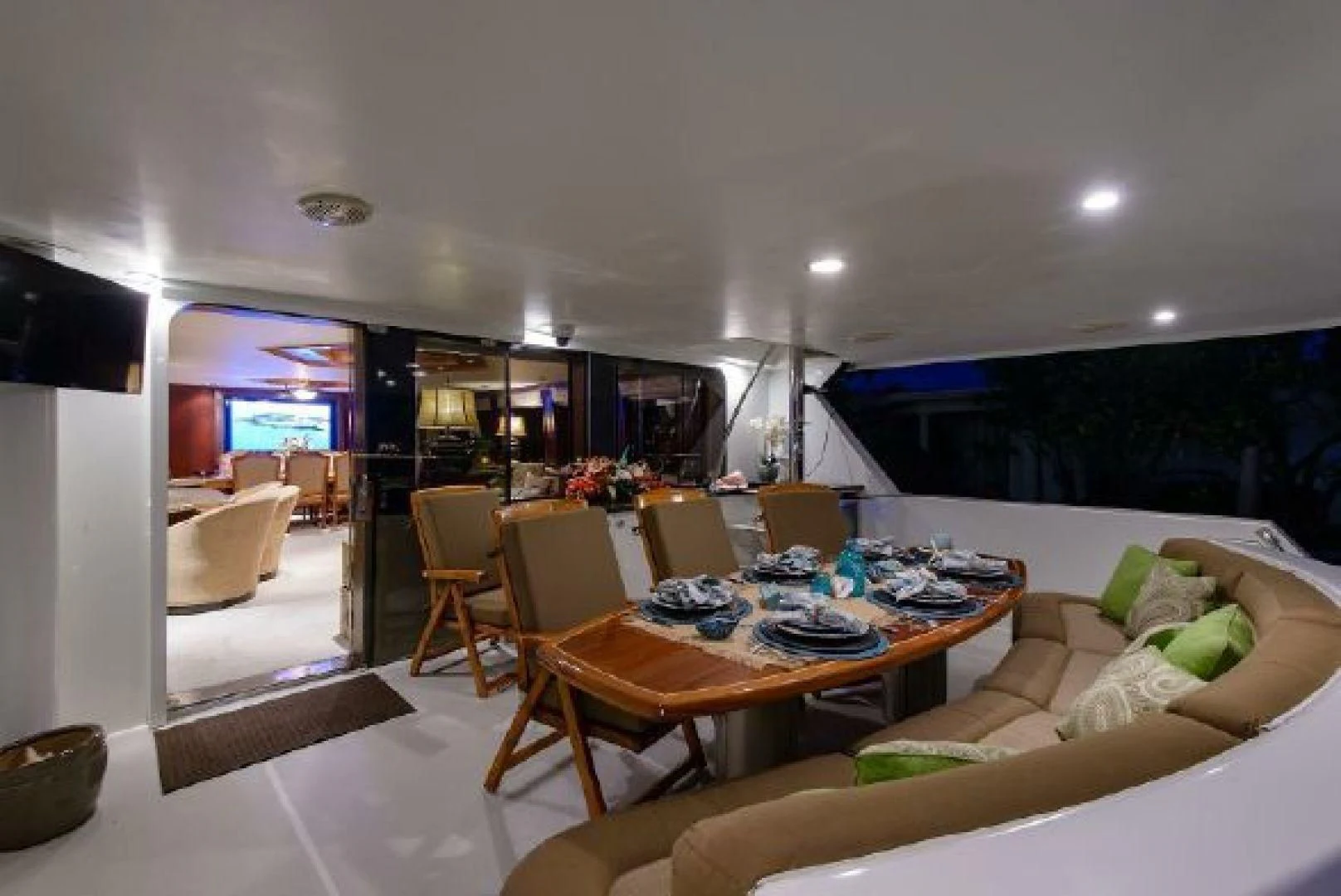 a living room with a table and chairs aboard NO EXCEPTIONS Yacht for Sale