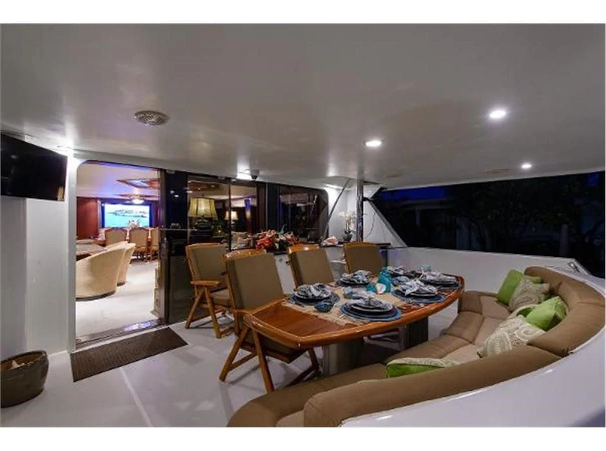 a living room with a couch and a table aboard NO EXCEPTIONS Yacht for Sale