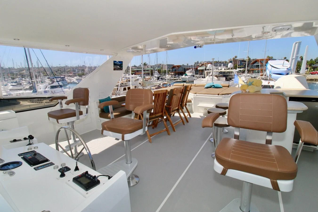a room with a table chairs and a laptop on the floor aboard NO EXCEPTIONS Yacht for Sale