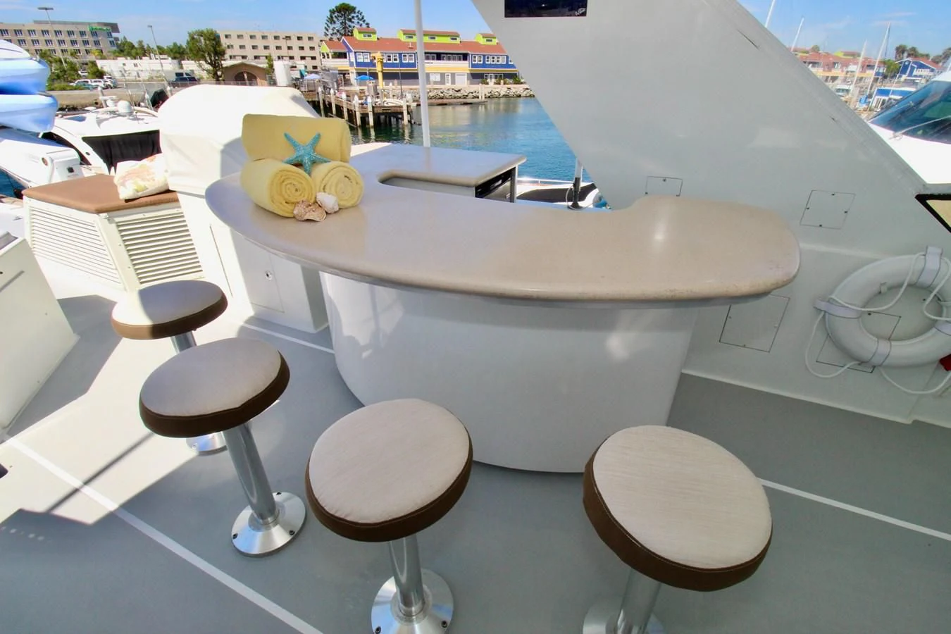 a white table with chairs around it aboard NO EXCEPTIONS Yacht for Sale