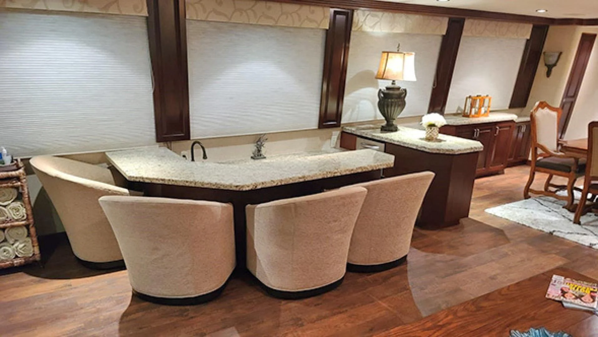 a room with a large round table and chairs aboard NO EXCEPTIONS Yacht for Sale