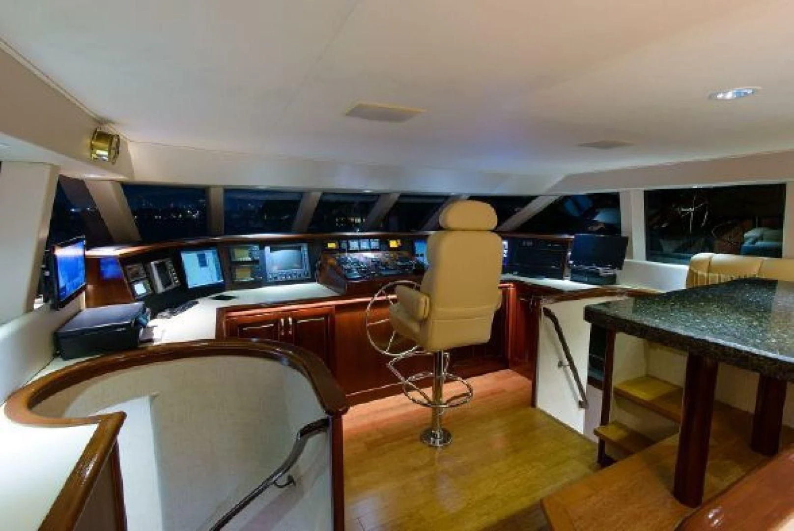 a room with tables and chairs aboard NO EXCEPTIONS Yacht for Sale