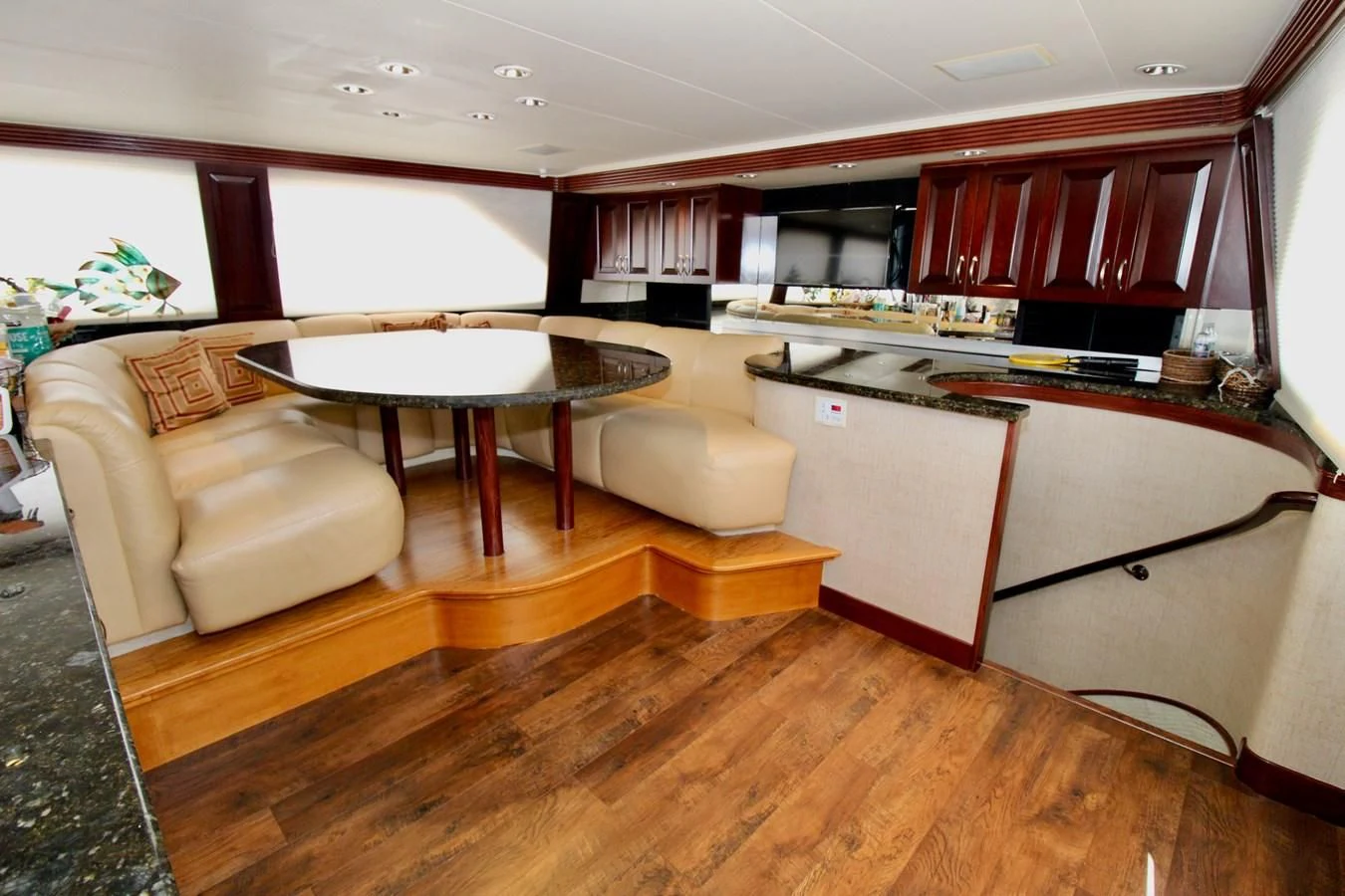 a living room with a table and couches aboard NO EXCEPTIONS Yacht for Sale