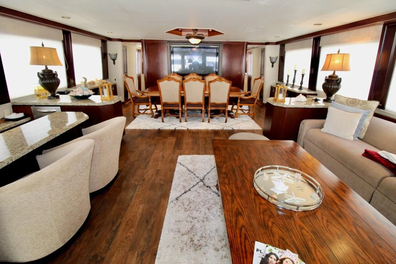 a living room with a dining table aboard NO EXCEPTIONS Yacht for Sale