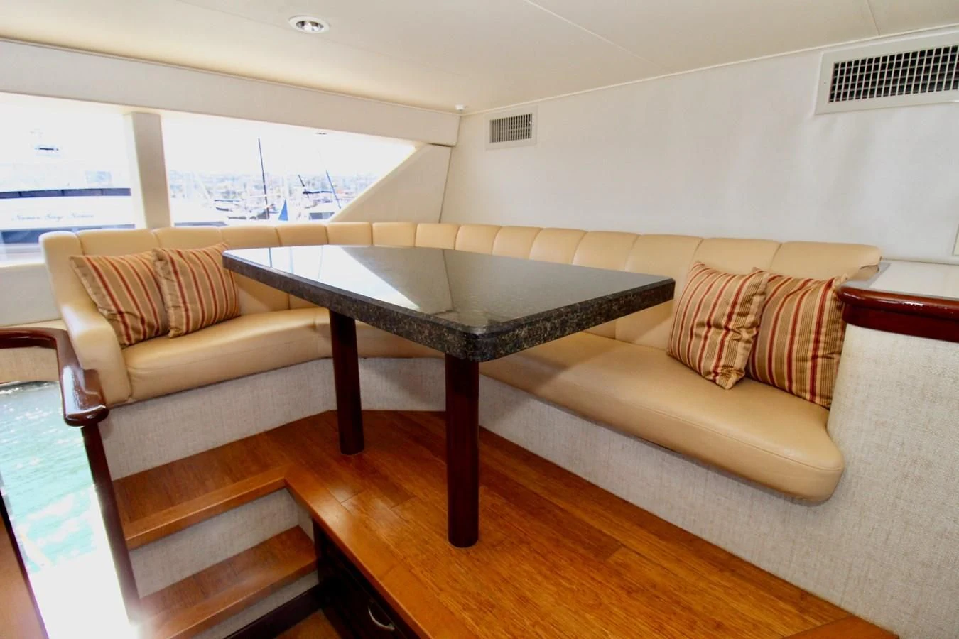 a living room with a couch and a table aboard NO EXCEPTIONS Yacht for Sale