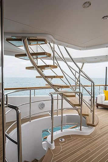 a large white boat on a deck aboard JODI ANN Yacht for Charter