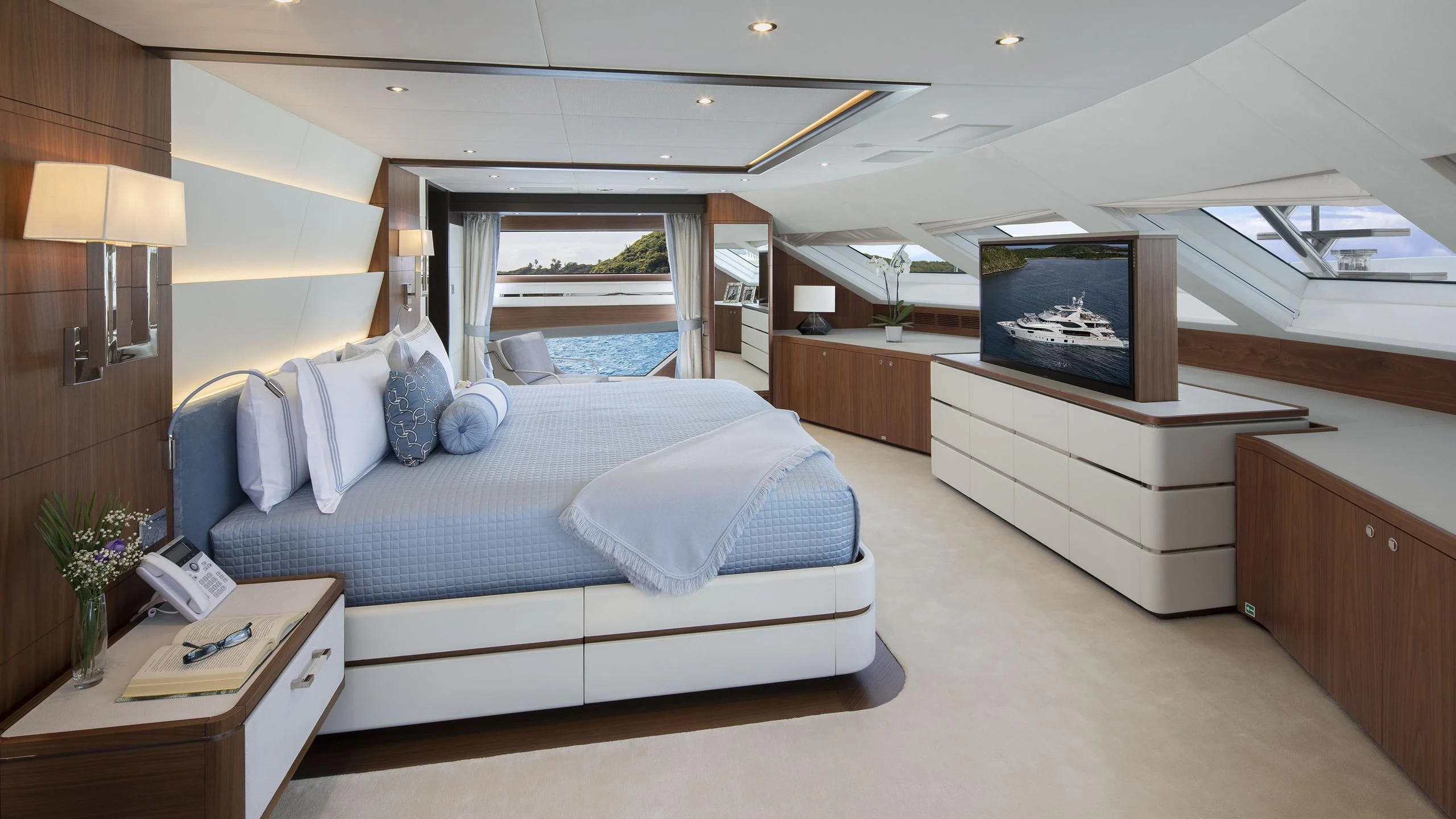 a bedroom with a large bed aboard JODI ANN Yacht for Charter