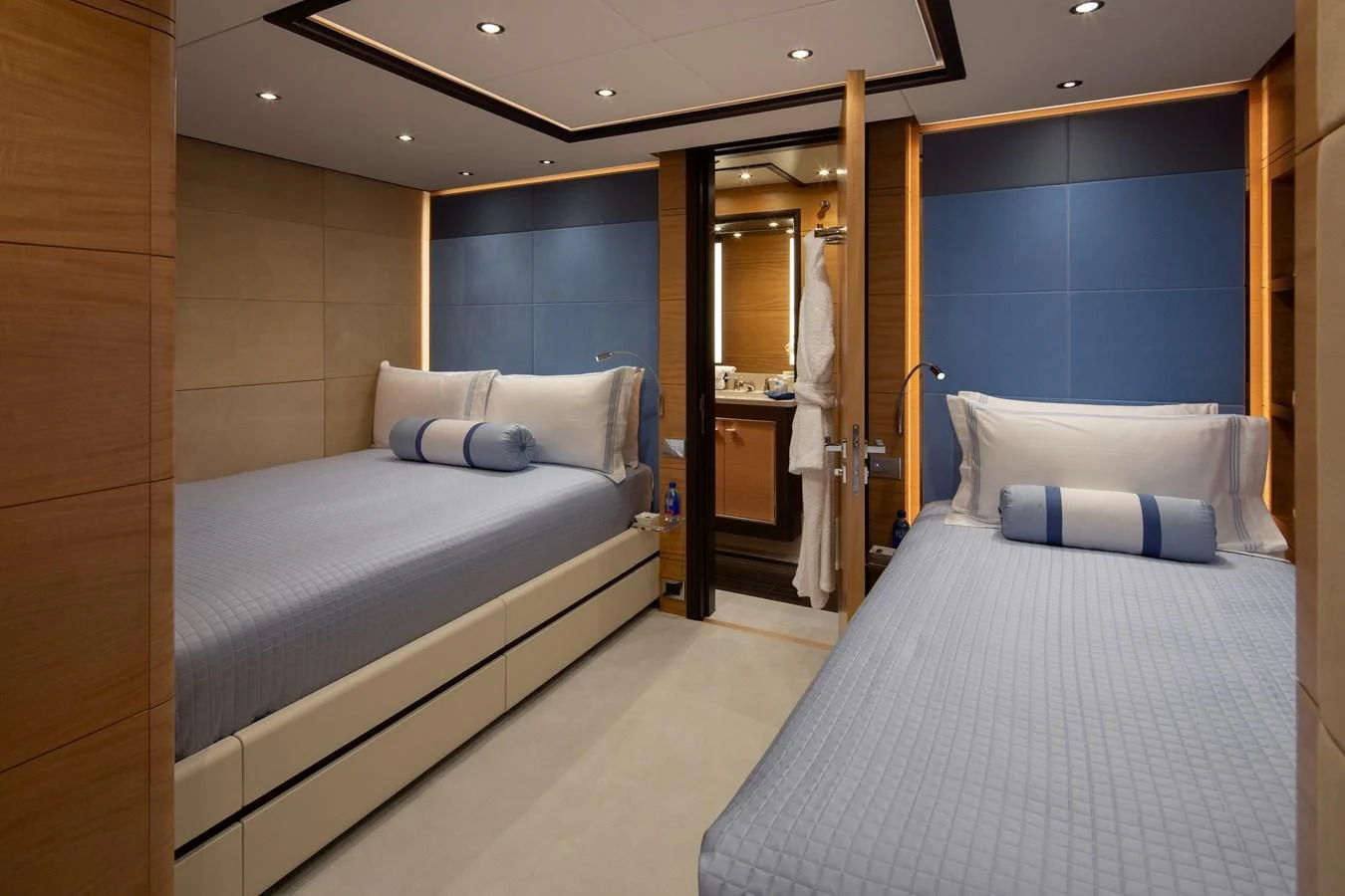 a room with a bed and a mirror aboard JODI ANN Yacht for Charter
