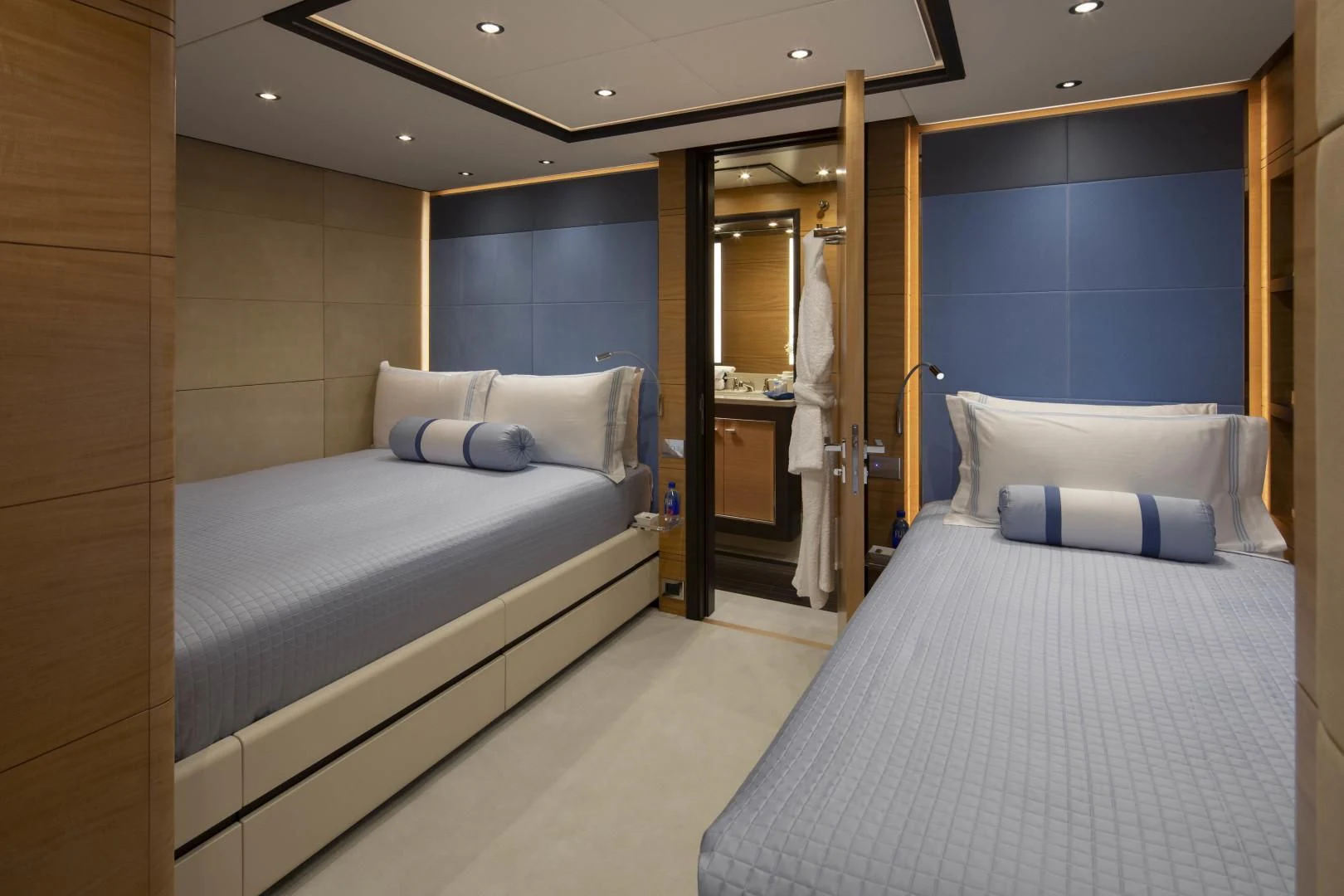 a room with a bed and a mirror aboard JODI ANN Yacht for Charter