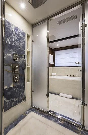 a bathroom with a glass shower aboard JODI ANN Yacht for Charter