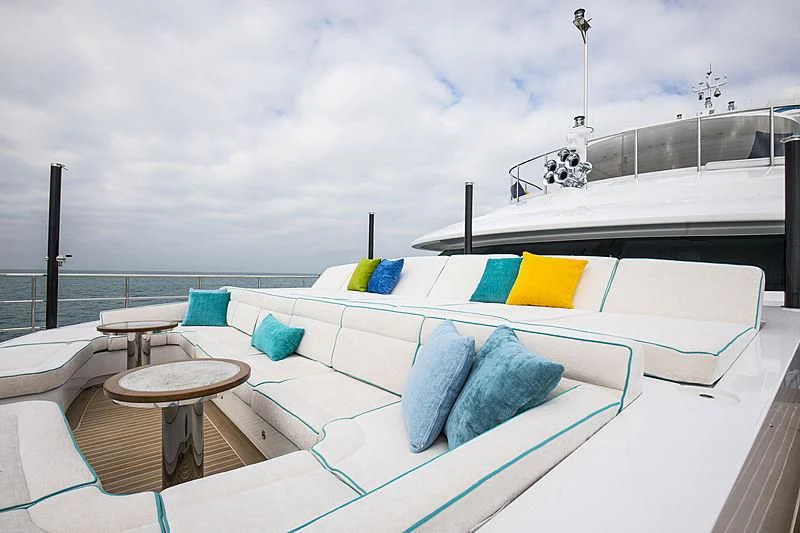 a pool with a table and chairs aboard JODI ANN Yacht for Charter