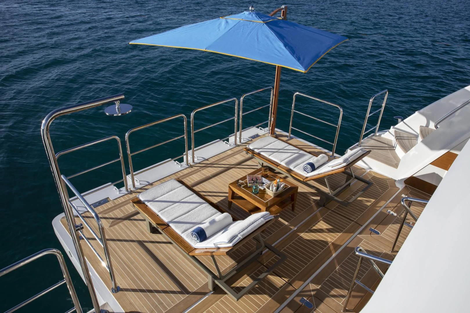 a boat with an umbrella on it aboard JODI ANN Yacht for Charter