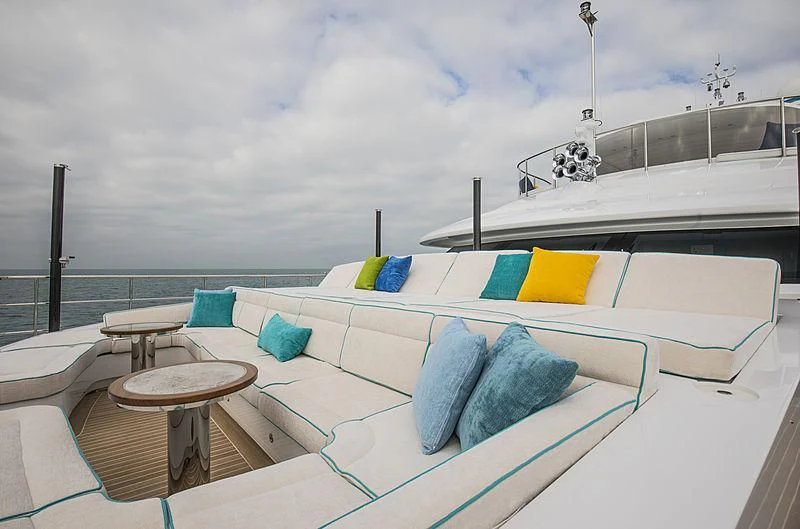 a pool with a table and chairs aboard JODI ANN Yacht for Charter