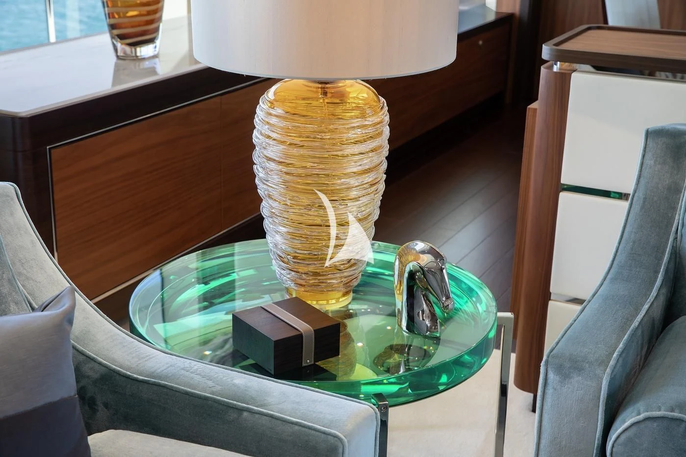 a lamp on a glass table aboard JODI ANN Yacht for Charter