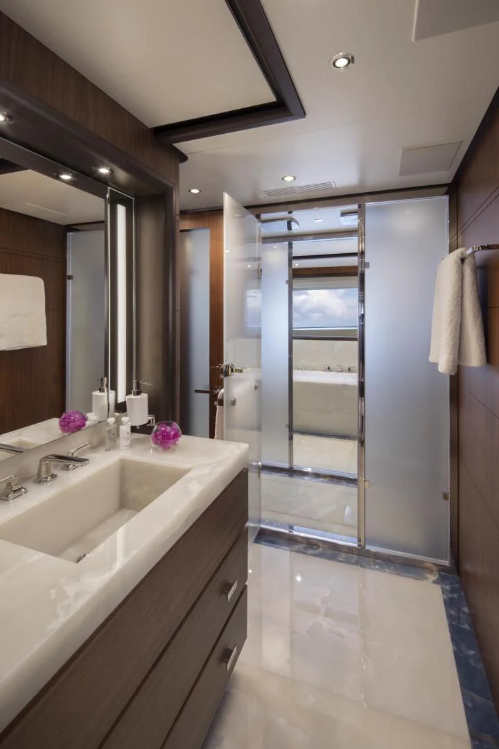 a bathroom with a shower unit and sink aboard JODI ANN Yacht for Charter