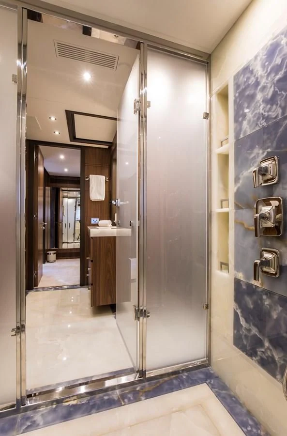 a bathroom with a large mirror aboard JODI ANN Yacht for Charter
