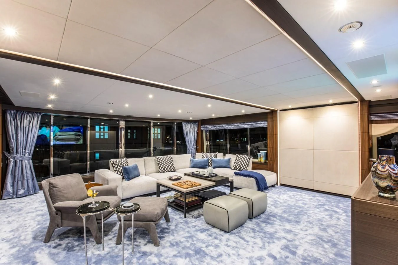 a living room with a large window aboard JODI ANN Yacht for Charter