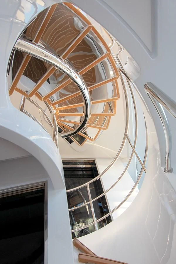 a white building with a spiral staircase aboard JODI ANN Yacht for Charter