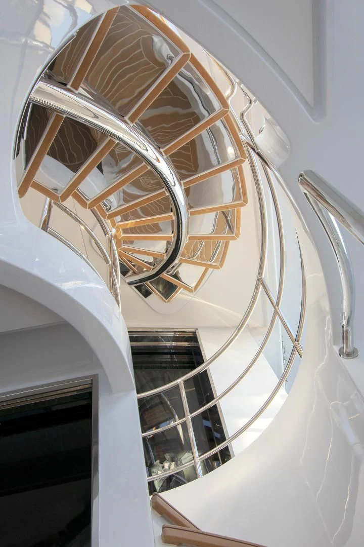 a white building with a spiral staircase aboard JODI ANN Yacht for Charter