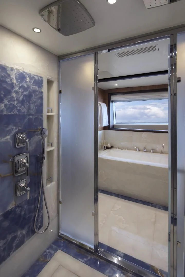 a bathroom with a glass shower aboard JODI ANN Yacht for Charter