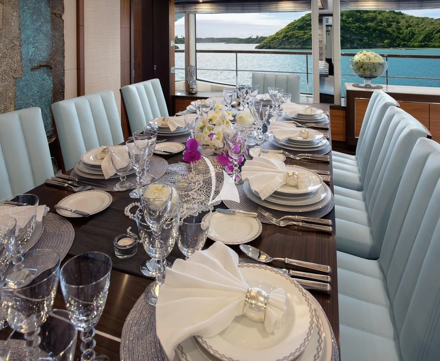 a table set with plates and silverware aboard JODI ANN Yacht for Charter