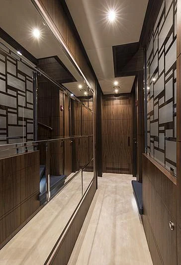 a hallway with a large glass wall aboard JODI ANN Yacht for Charter