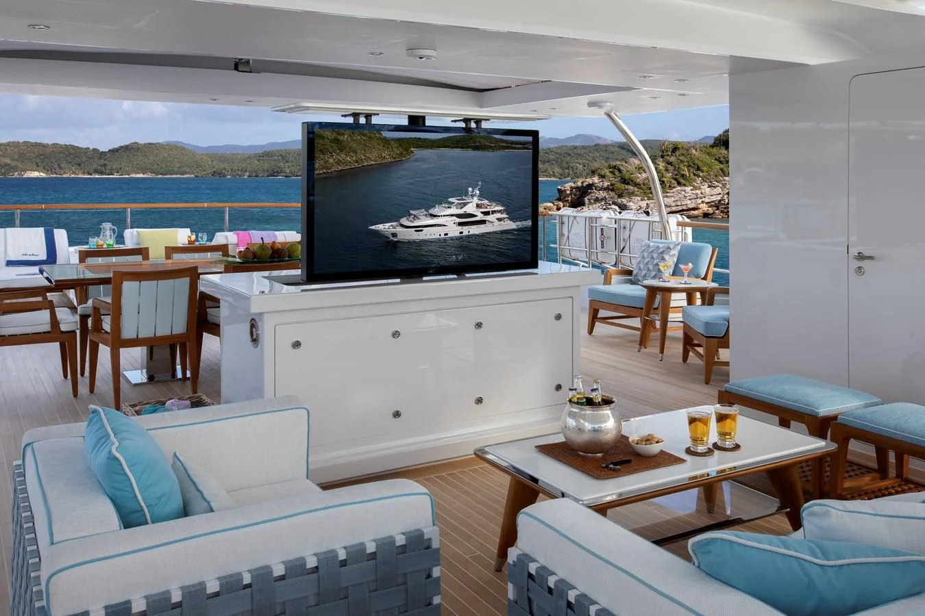 a living room with a large screen aboard JODI ANN Yacht for Charter
