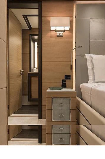 a bathroom with a wood door aboard JODI ANN Yacht for Charter