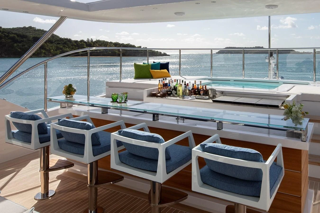 a room with a pool and a deck with chairs and a table aboard JODI ANN Yacht for Charter