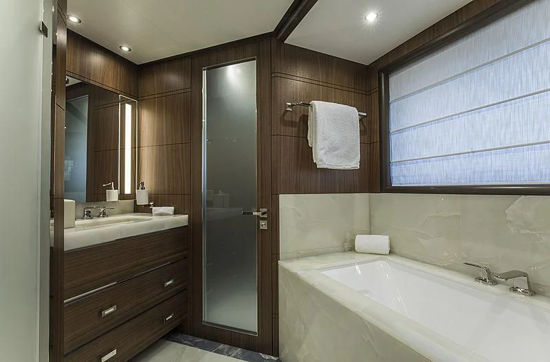 a bathroom with a bathtub and sink aboard JODI ANN Yacht for Charter