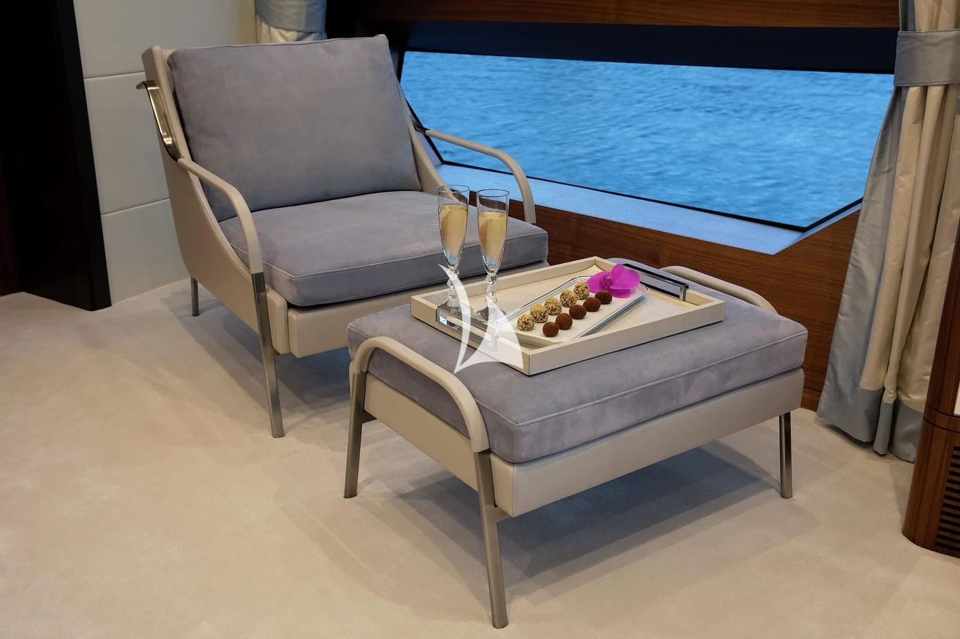 a white chair next to a pool aboard JODI ANN Yacht for Charter