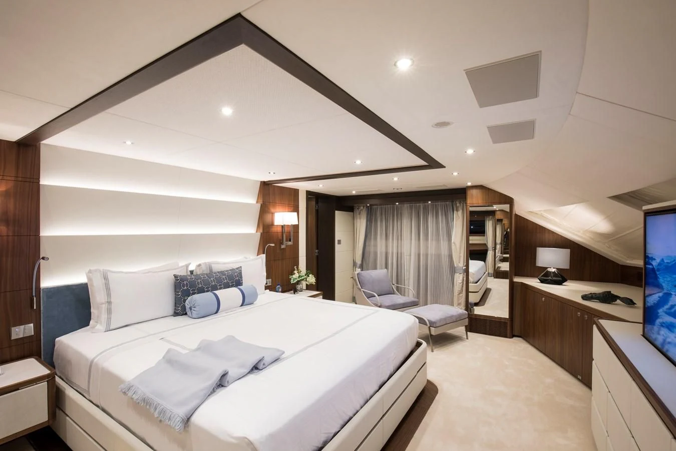 a bedroom with a bed and a desk aboard JODI ANN Yacht for Charter
