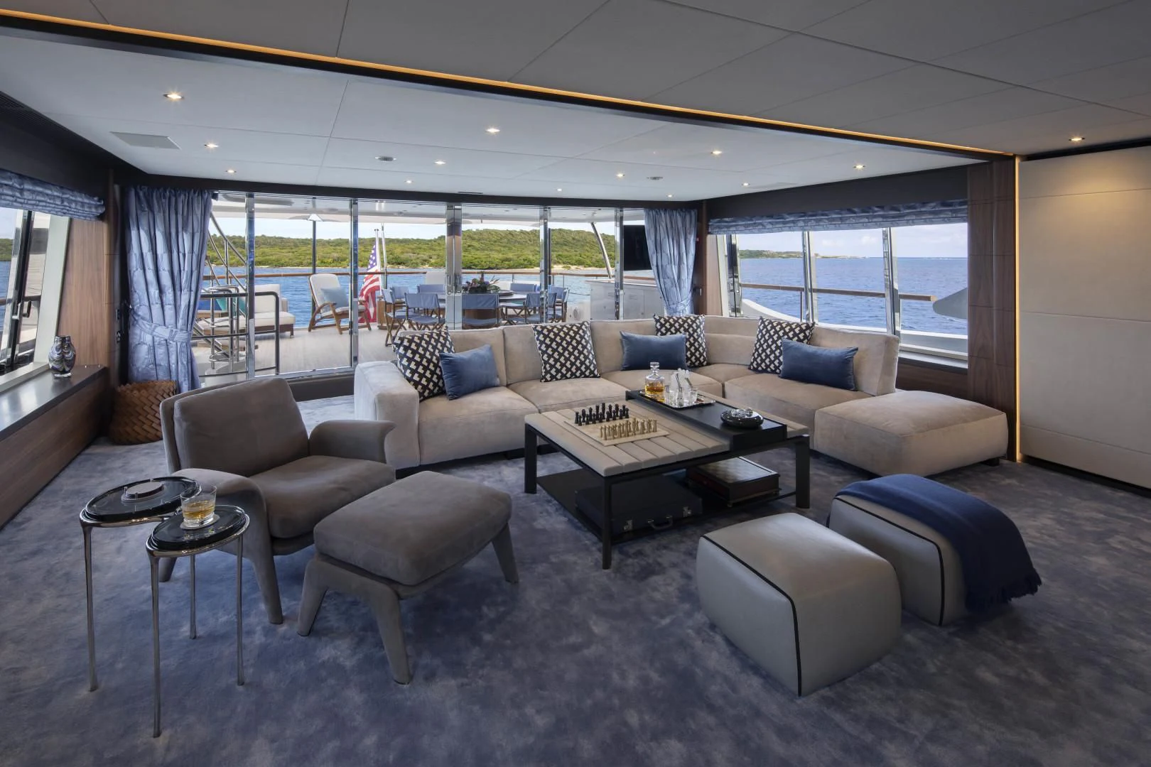 a living room with a large window aboard JODI ANN Yacht for Charter