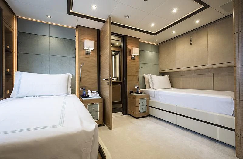 a room with a couple of beds aboard JODI ANN Yacht for Charter