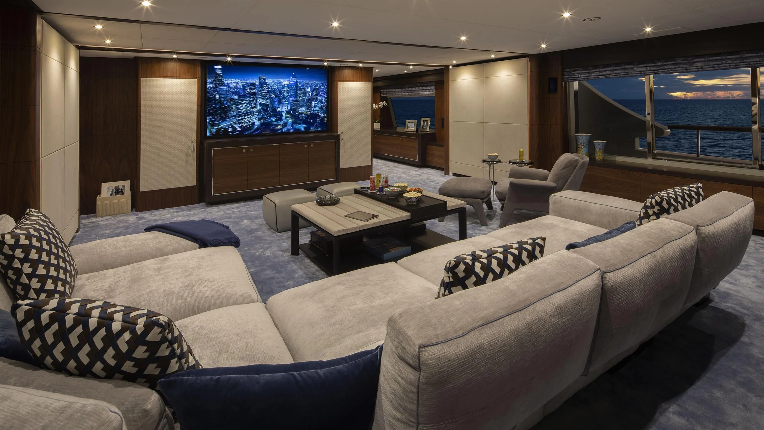 a living room with a large screen aboard JODI ANN Yacht for Charter
