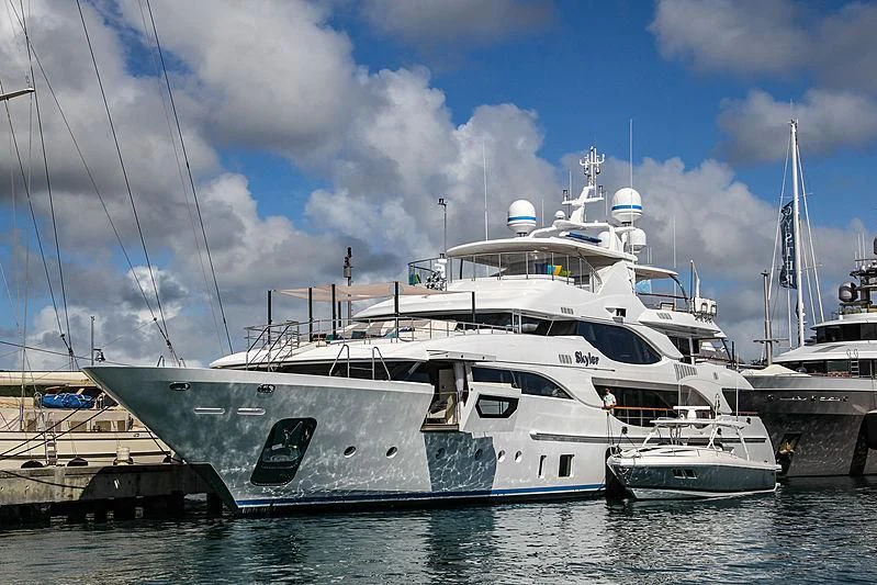 a large white boat docked aboard JODI ANN Yacht for Charter